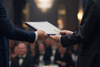 Certificate exchange at a formal business awards ceremony