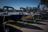 Aluminium tinnie fishing boats on display beside the Brisbane River