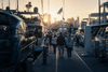 Visitors walking a marina pontoon between moored yachts at a Melbourne boat show