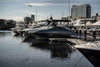 Adelaide waterfront marina in soft spring light during a boat show