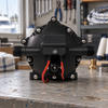 Back view of the Savwinch Deck Wash Pump head showing the inlet and outlet ports on a workshop bench