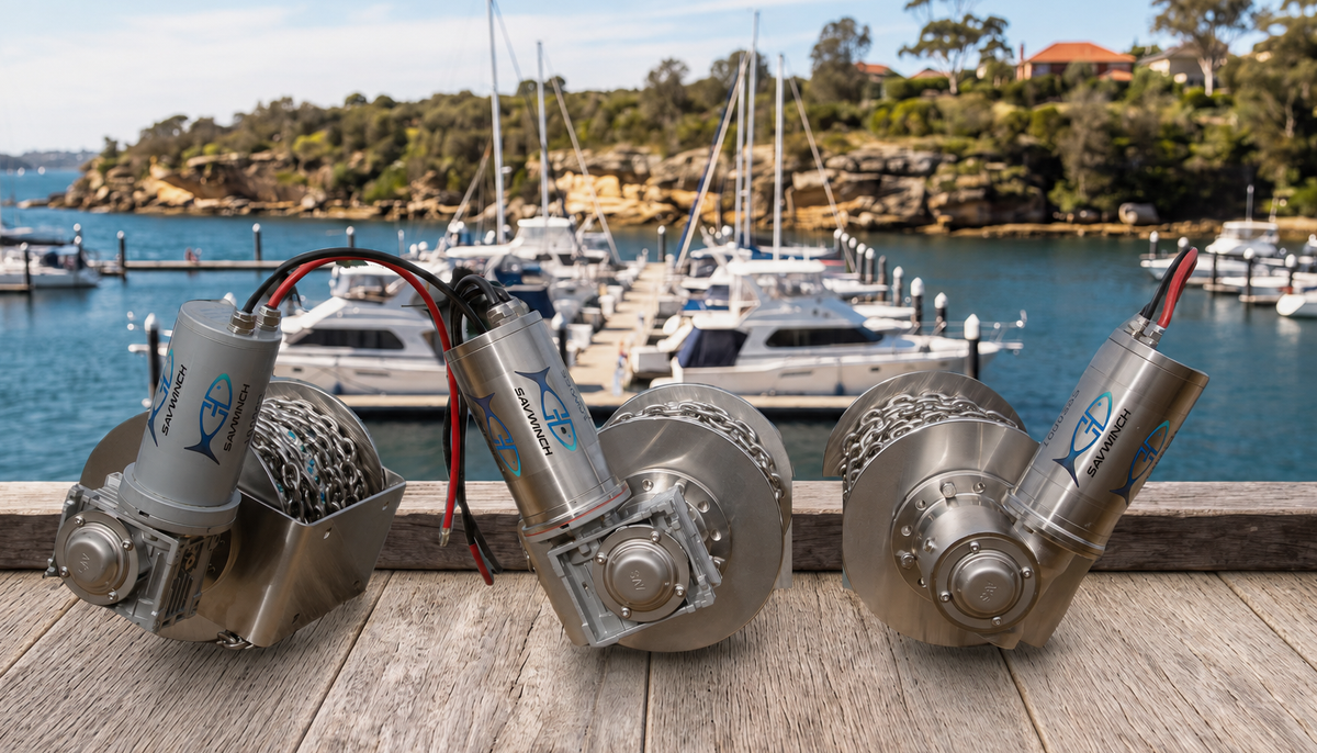 Savwinch 1000SS Signature Series electric drum anchor winch with chain wound on the drum, moored boats behind at a marina