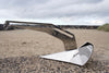 Savwinch 7.5kg stainless steel Slider anchor on a coastal groyne, patented sliding ring slot visible in the shank
